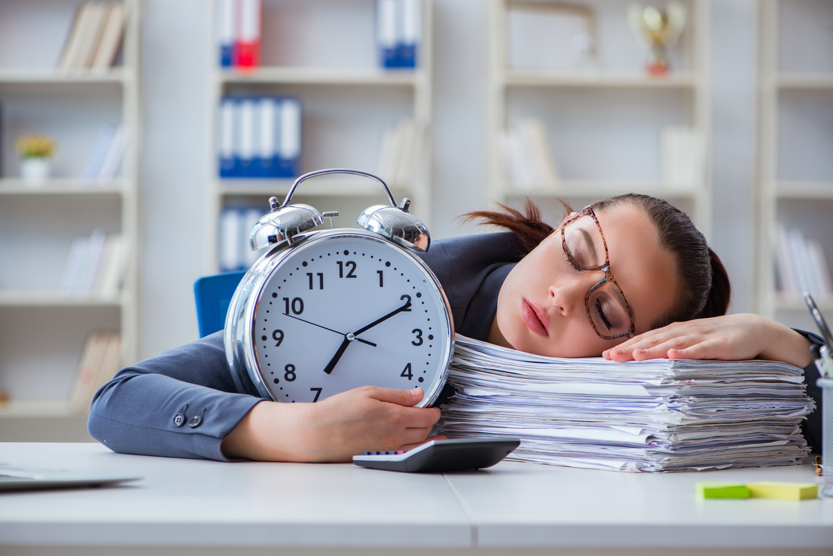 Employee Asleep on a Pile of Paperwork 