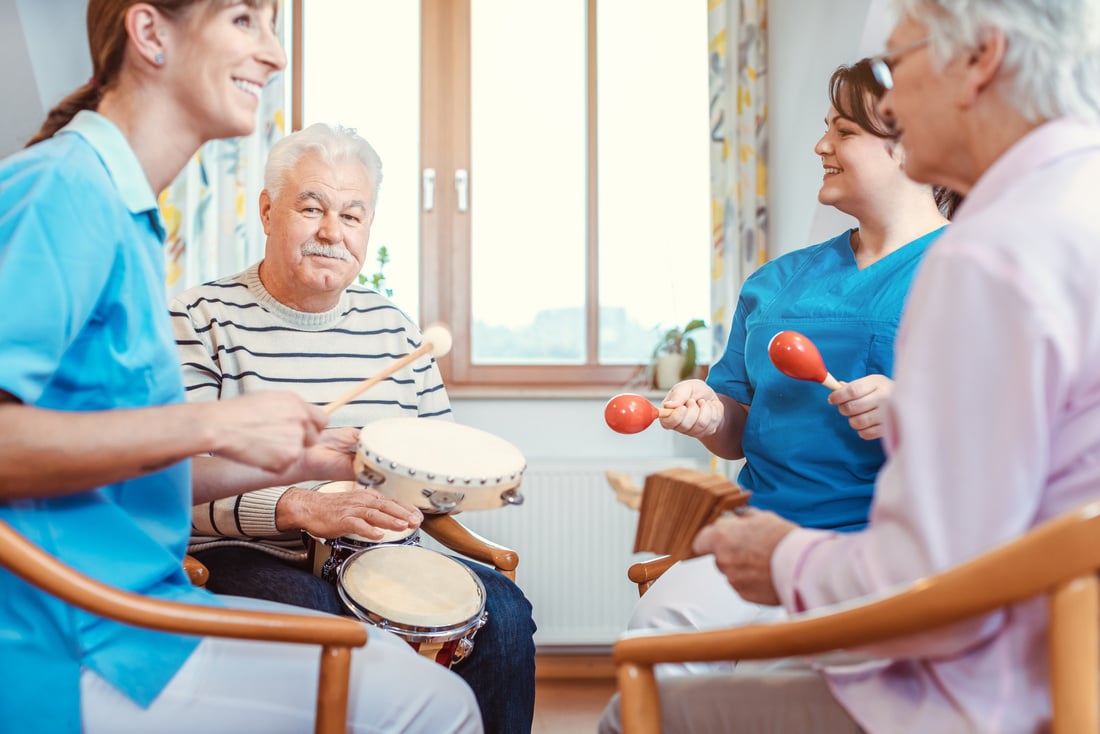 Seniors in Nursing Home Making Music with Rhythm Instruments